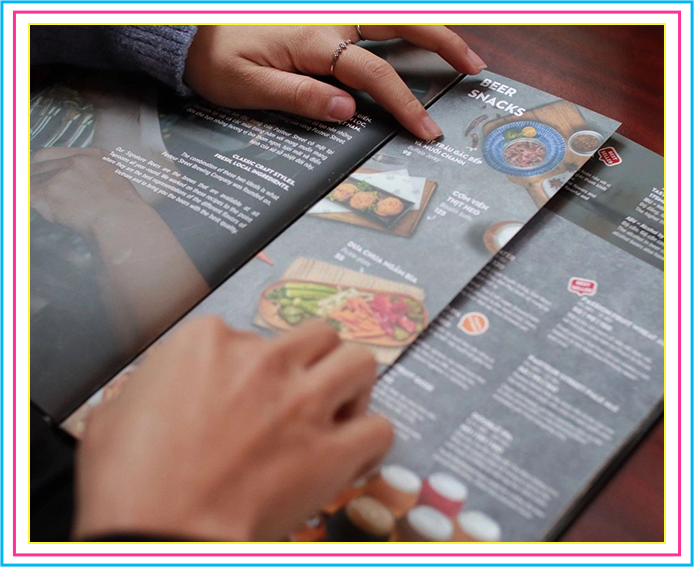 A person is reading the menu of a restaurant.