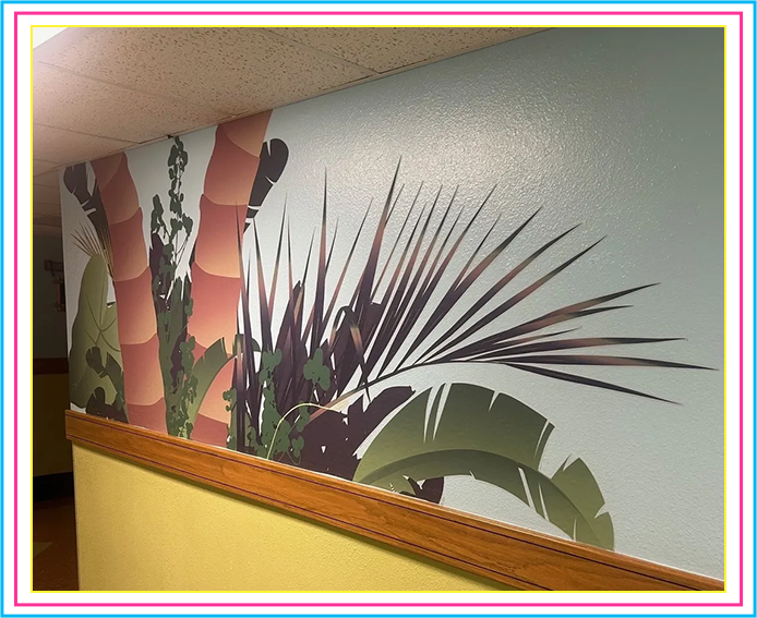 A wall mural of palm trees and bananas.